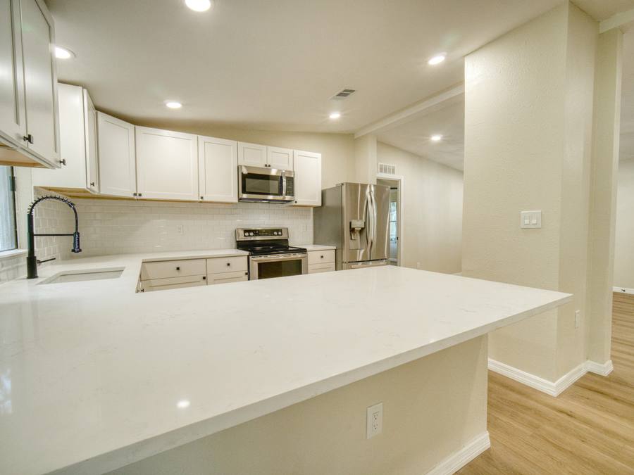 Renovated kitchen with quartz counters